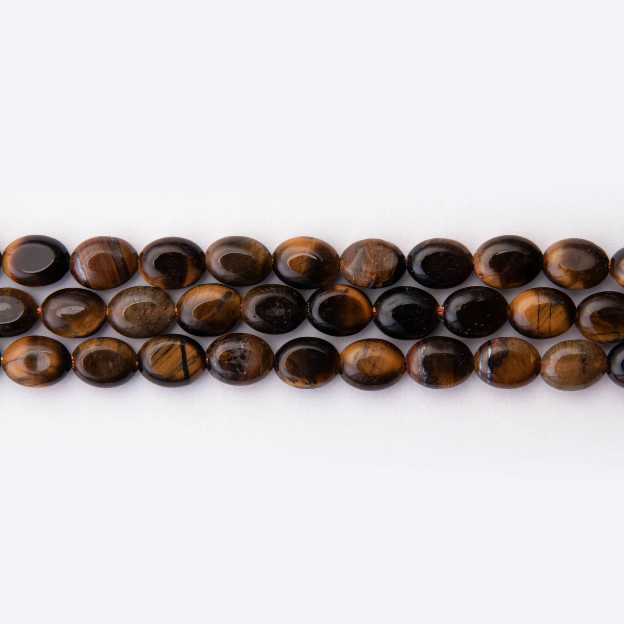 02364 LQ Tiger Eye Natural Stone 6×8mm Oval Polished - Image 1