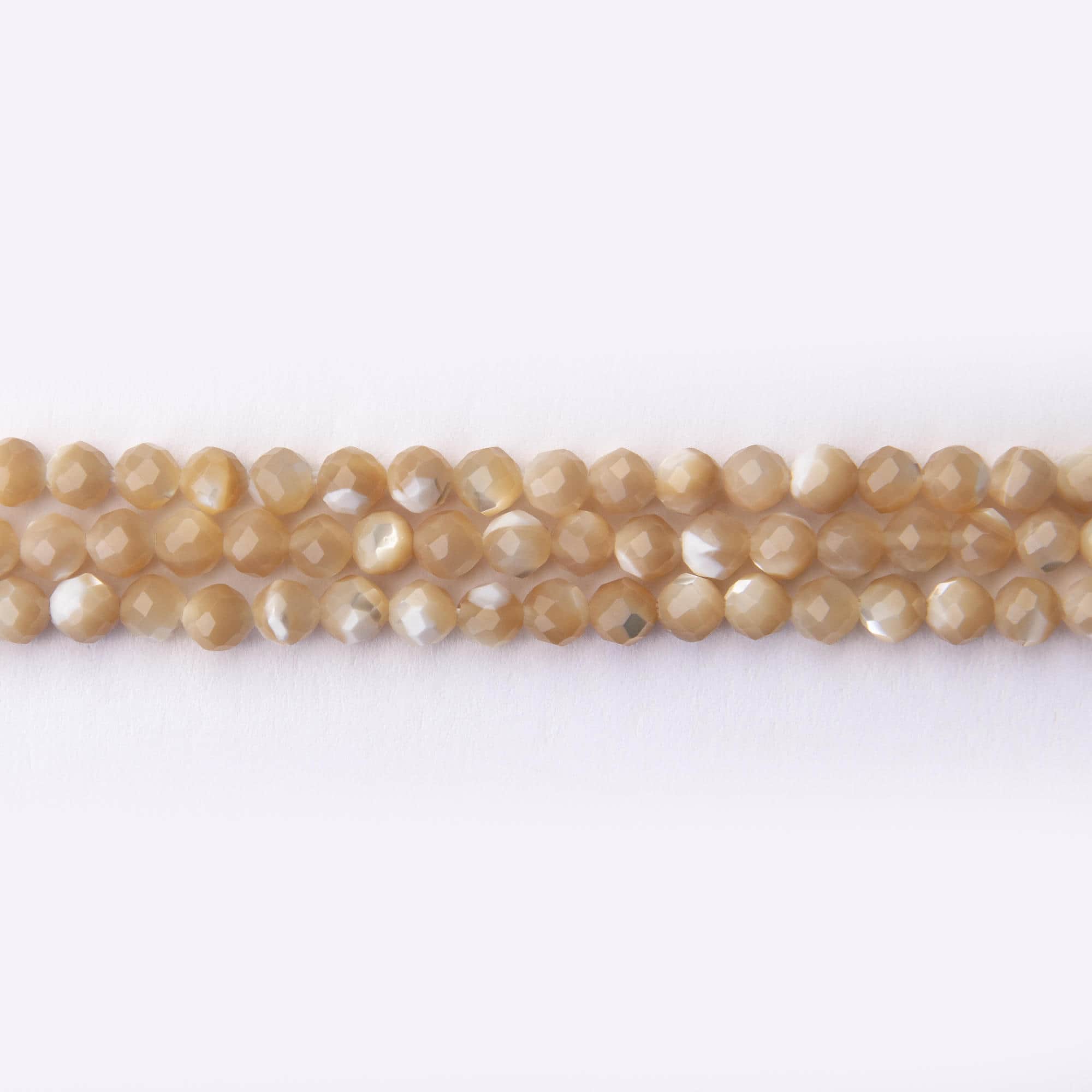 02383 LQ Natural Cream Yellow Shell 4mm Round Faceted - Image 1