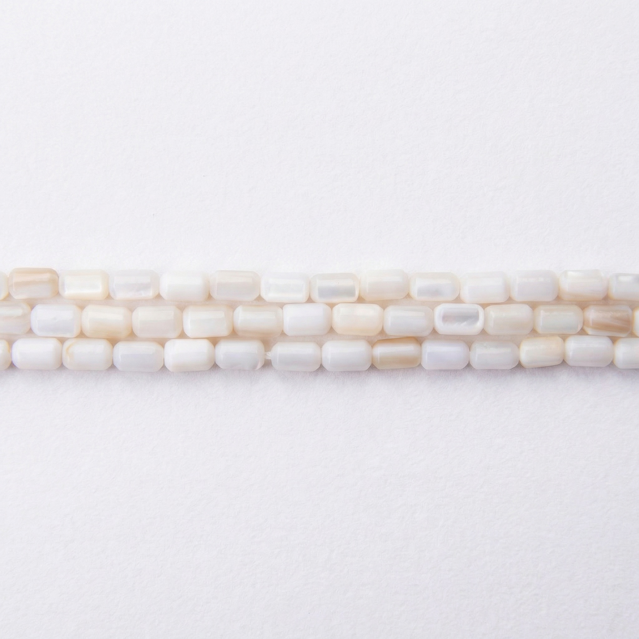 03241_LQ Natural White Shell 3×5mm Cylinder Polished - Image 1