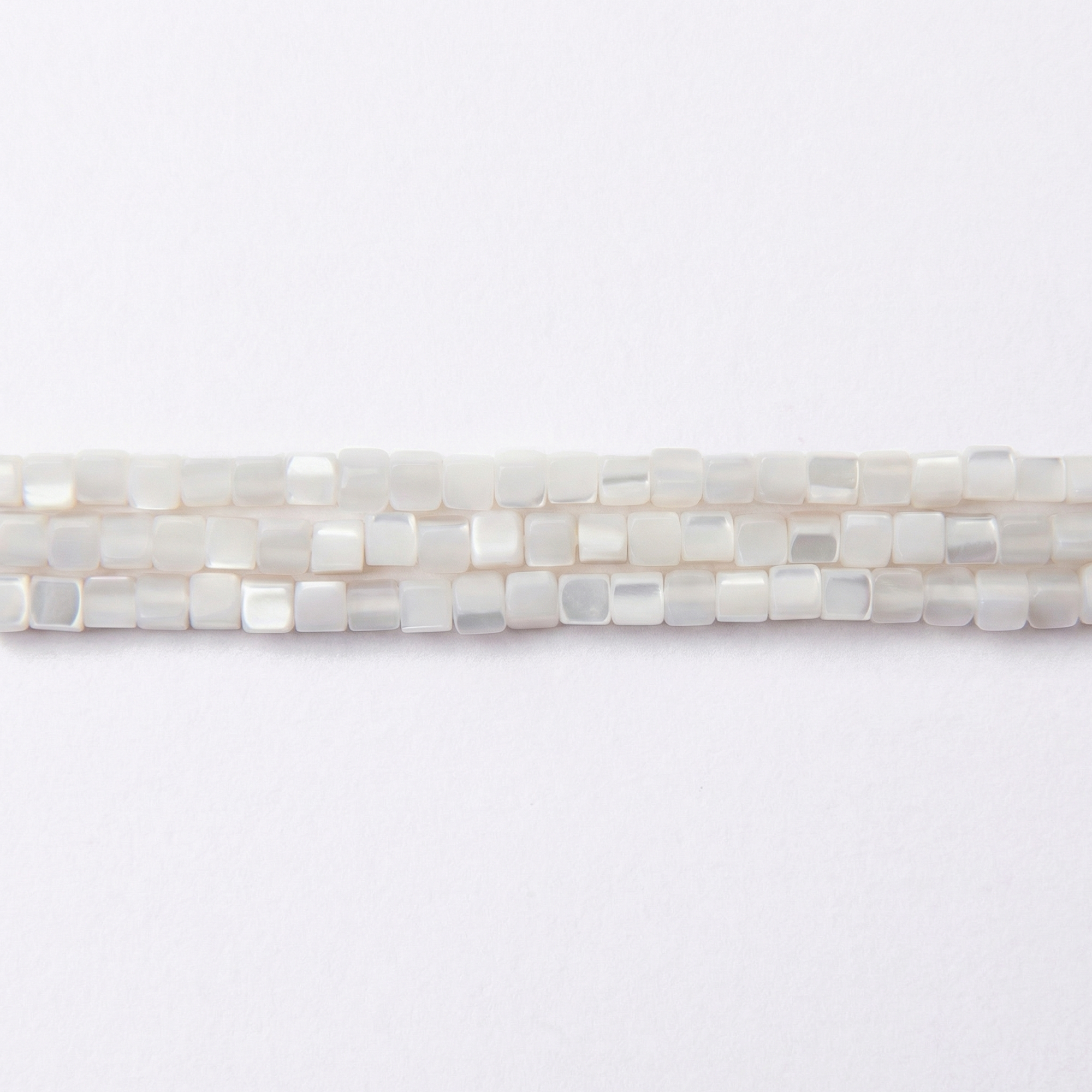 03244-LQ Natural White Shell 3mm Cube Polished - Image 1